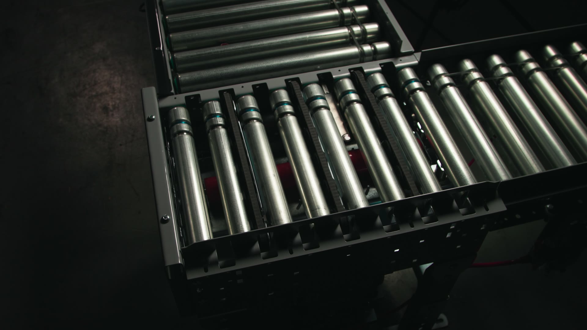 A powered-roller conveyor line in motion on the System Technology shop floor