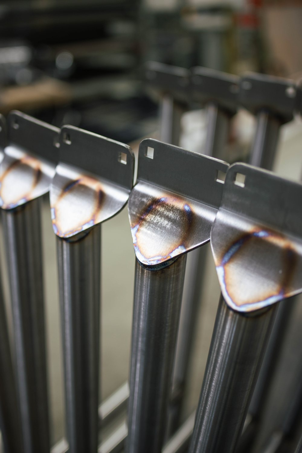 Polished stainless gravity-roller conveyor sections in the shop