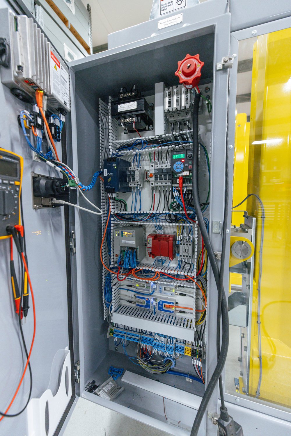 An open UL-508A control panel showing internal wiring built in the STI panel shop